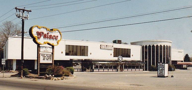 The Palace nightclub in Saugus, a long white building with a round glass tower and the script Palace sign out front